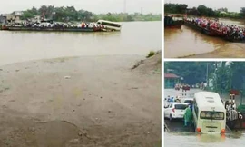 Hình ảnh ôtô khách nửa trên phà, nửa "tắm sông" khi qua phà Mây (Hải Dương). Ảnh: CTV