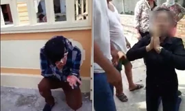 Đôi nam nữ bị đánh bầm dập vì nghi dùng thuốc mê cướp tài sản. Ảnh cắt từ clip