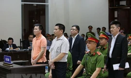 Các bị cáo nghe Hội đồng xét xử tuyên án. (Ảnh: Dương Giang/TTXVN)