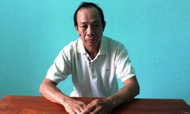 Nghi phạm Nguyễn Quốc Long tại cơ quan công an