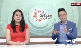 Hương Giang lần đầu dẫn bản tin "Cà phê sáng với VTV3" cùng MC Lê Anh.