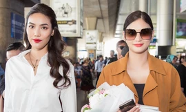 Pia Wurtzbach (phải) nhận hoa chào mừng từ Lan Khuê.