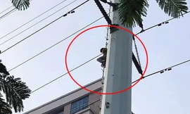 Người đàn ông cố thủ trên cột điện cao thế đường Lê Văn Lương kéo dài