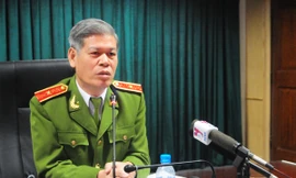 Thiếu tướng Đỗ Đình Nghị, Phó Tổng cục trưởng Tổng Cục cảnh sát QLHC về TTATXH - Bộ Công an trả lời báo chí chiều 12-11. Ảnh: Tuấn Nguyễn