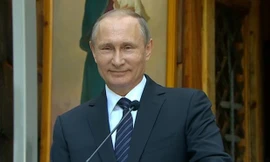 Báo Anh giải mã nụ cười bí ẩn của ông Putin