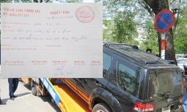 Xe cẩu kéo do CSGT gọi đang có giá chặt chém, riêng phiếu thu 18 triệu đồng phí cẩu kéo xe 29C-76290 (ảnh nhỏ) do Đội CSGT số 14 gọi đắt gần 10 lần.
