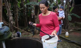 Bà Liên bên giếng nước bốc khói