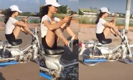 Rợn người nữ sinh điều khiển xe máy bằng chân, tay chơi điện thoại
