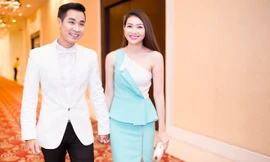 MC Nguyên Khang tình tứ nắm tay Miss Ngôi Sao Bích Khanh đi dự tiệc.