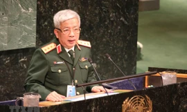 Thượng tướng Nguyễn Chí Vịnh, Thứ trưởng Bộ Quốc phòng phát biểu tại Hội nghị. (Ảnh: Hữu Thanh/TTXVN)