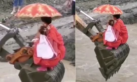 Lũ cuốn trôi cầu, cô dâu chú rể 'cưỡi' máy xúc qua sông đến lễ đường