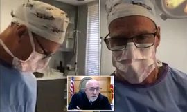 Bác sĩ Green tham gia phiên tòa trực tuyến khi đang phẫu thuật. 