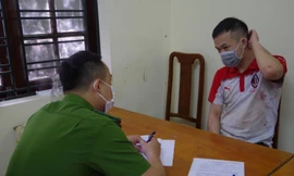 Nghi can Lành Đức Giang tại cơ quan công an.