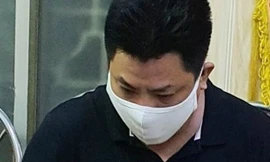 Phạm Phi Long tại cơ quan công an, ảnh: công an cung cấp.