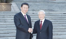 Tổng Bí thư, Chủ tịch nước Trung Quốc Tập Cận Bình đón Tổng Bí thư Nguyễn Phú Trọng. Ảnh: TTXVN.