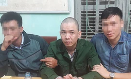 Nguyễn Văn Tình sau khi bị cảnh sát bắt giữ.