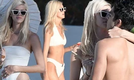 Thiên thần nội y Devon Windsor mặc bikini hôn chồng hậu đám cưới