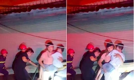 Cảnh sát phá cửa cuốn, giải cứu cháu bé khuyết tật cùng 5 người ra khỏi đám cháy