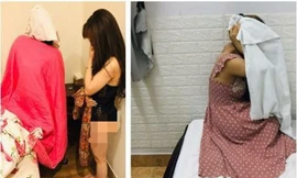 Hai cô gái bán dâm trong nhà nghỉ bị công an bắt quả tang. 