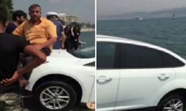 Dùng trọng lượng cơ thể để giữ ô tô không lao xuống biển