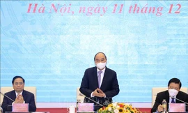 Chủ tịch nước Nguyễn Xuân Phúc chủ trì hội thảo. Ảnh TTX VN.