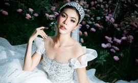 Dân tình xôn xao trước loạt ảnh mặc váy cưới của siêu mẫu Minh Tú sau khi chủ động cầu hôn bạn trai Tây