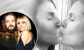 Chờ kết quả xét nghiệm Covid-19, siêu mẫu Đức hôn chồng qua kính cách ly