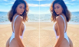 Á hậu Mâu Thuỷ mặc áo tắm cắt xẻ táo bạo khoe vòng ba 'bỏng rẫy'