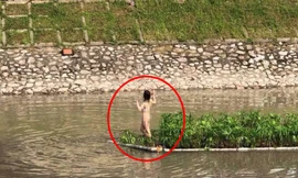 Hình ảnh cô gái giữa sông Tô Lịch. Ảnh: Facebook