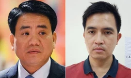 Bị can Nguyễn Đức Chung (phải) và Nguyễn Trường Giang 