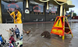 Công nhân xí nghiệp thoát nước số 2 thu gom rác và túi nilon tại miệng cống thoát nước sáng 17/7 trên đường Hồ Tùng Mậu, Cầu Giấy, Hà Nội (ảnh lớn). CSGT đang phân luồng giao thông (ảnh nhỏ). Ảnh: Ngọc Châu