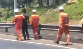 Người đàn ông phóng xe không mũ bảo hiểm xuyên hầm Hải Vân