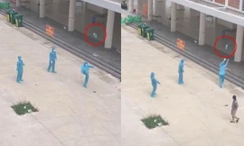 Giây phút thư giãn hiếm hoi: Nhân viên chống dịch mặc nguyên đồ bảo hộ chơi đá cầu