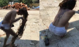 Cô gái bị lột áo, đổ mắm tôm lên người.