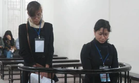 Hai bị cáo trong phiên xử ngày 4/3. Ảnh: BH