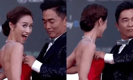 Sao nam gây tranh cãi khi dùng tay chỉnh phần váy cúp ngực cho con gái