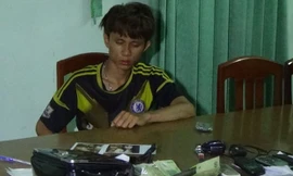 Quý tại cơ quan công an. 