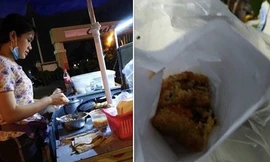 Cô gái bán xôi chiên giá 5.000 đồng tặng cả áo mưa cho khách. Ảnh chụp màn hình.