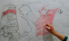 Hình ảnh Trường Sa được các em thể hiện bằng hình vẽ trên bảng mica. Ảnh cắt từ clip.