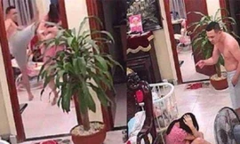 Hình ảnh người chồng đánh vợ mới sinh tại phường Thạch Bàn, quận Long Biên (Ảnh cắt từ clip)