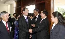 Chủ tịch nước Trần Đại Quang đến thăm, nói chuyện với cán bộ, nhân viên Đại sứ quán Việt Nam và đại diện cộng đồng Việt kiều đang học tập, làm ăn, sinh sống tại Lào trong chuyến thăm cấp nhà nước tới CHDCND Lào tháng 6/2016. (Ảnh: Nhan Sáng/TTXVN)