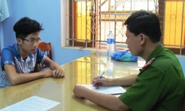 Lê Văn Quang tại cơ quan công an. 