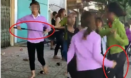 Nhóm nữ sinh cầm gậy sắt đánh nhau. Ảnh cắt từ clip