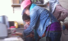 Làm thẻ sinh viên giả để thi hộ tại hiệu ảnh - Ảnh: Thanh Vạn