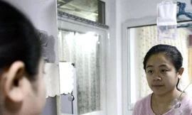 Li Xue là một trong hàng triệu đứa con thứ hai ở Trung Quốc chịu phận chui nhủi vì gia đình vi phạm chính sách kế hoạch hóa gia đình. Ảnh: AFP.