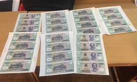 Kẻ sản xuất, tiêu thụ gần 1 tỷ đồng học in tiền giả... trên mạng