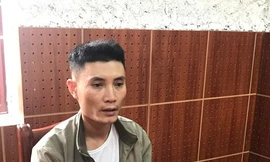 Đối tượng Vũ Văn Trung khai báo hành vi lừa đảo tại cơ quan công an *ảnh: TL