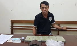 Đối tượng Khuynh cùng tang vật. Ảnh: TL