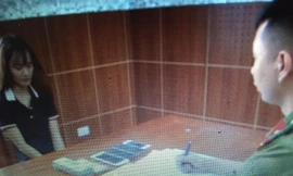 Đối tượng Uyên (bìa trái) khai nhận hành vi tại cơ quan điều tra *ảnh: TL