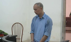 Nhiếp ảnh gia "rởm" tại phiên toà.